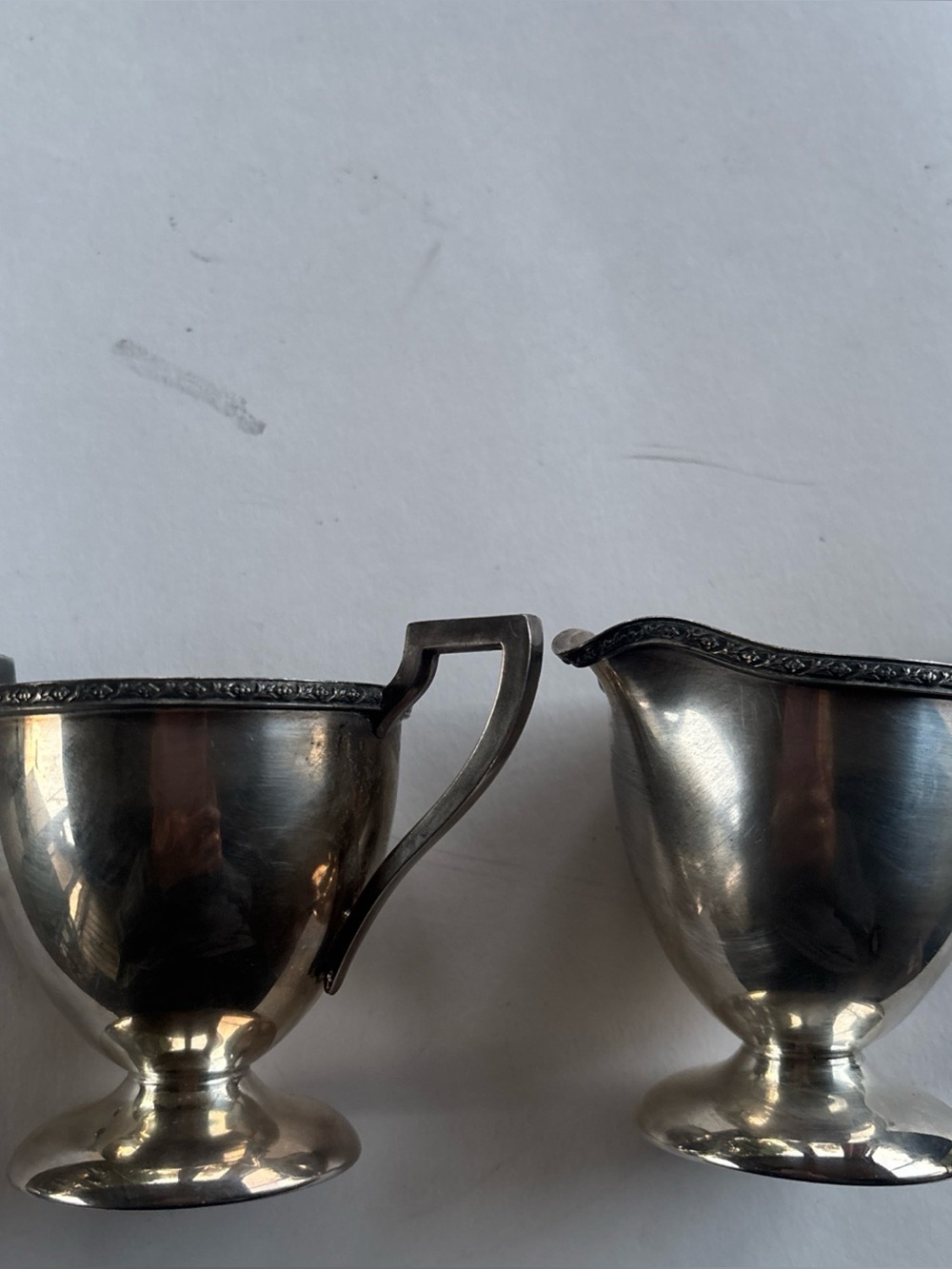 Silver Tone Creamer and Sugar Set with Decorative Rim